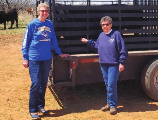 Hayhook Ranch Co-Owners Judy Baugher (left) and Edna Manning (right) deliver two limousin bulls to Haile Brothers Land & Cattle Co. in Newcastle. Courtesy photo